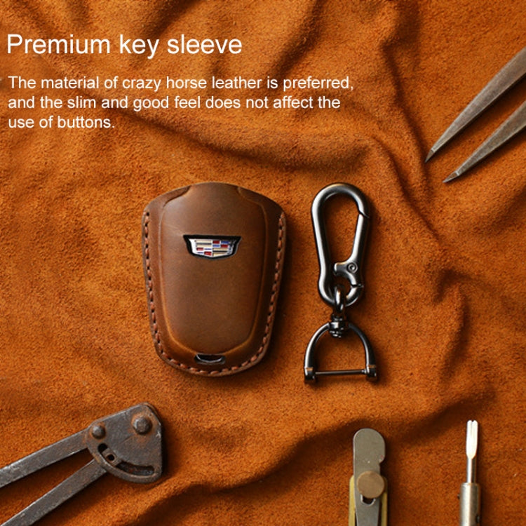 Brown leather key fob sleeve with Cadillac emblem and metal keychain hook