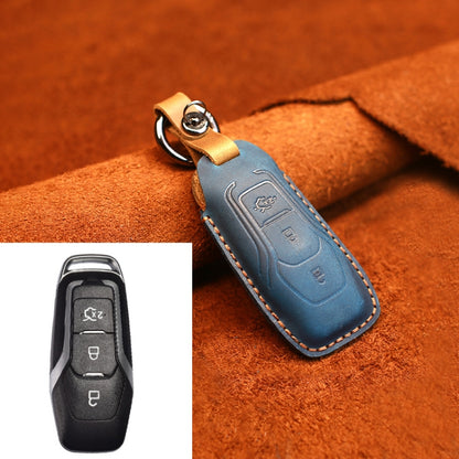 Blue leather key fob protective cover with keyring and visible button cutouts