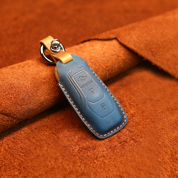 Blue leather key fob cover with keyring hardware and stitched edges