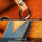 Leather key fob cover with tan strap and metal key ring, close-up view