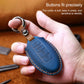 Nissan leather key protective cover case, blue held in hand with metal keyring