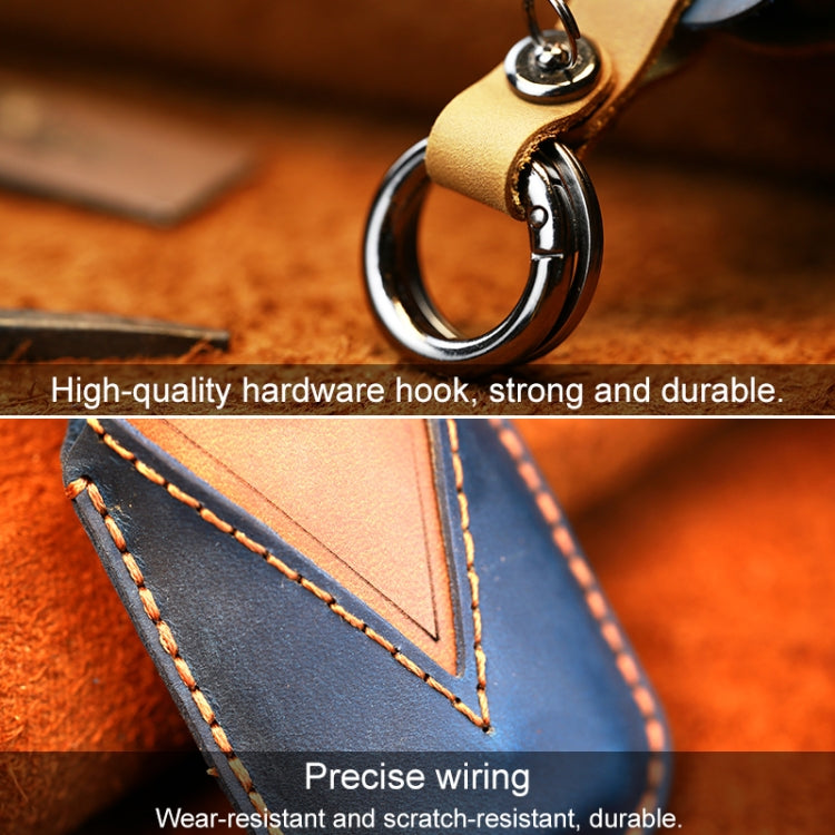 Blue leather key cover close-up with metal hook ring and reinforced stitching