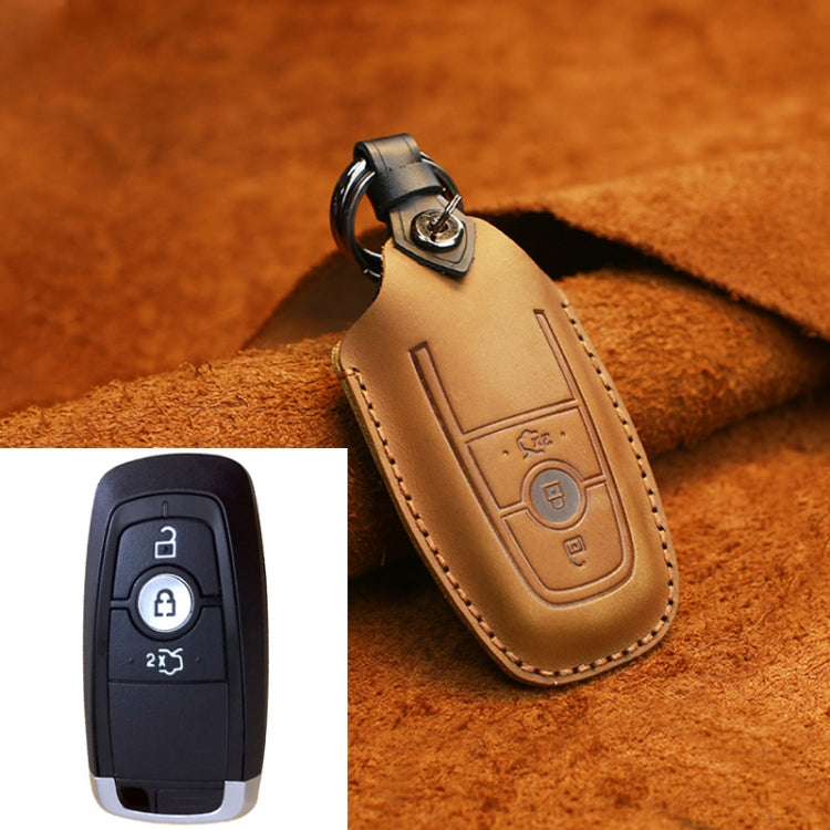 Tan leather key protective case with embossed remote icon and metal key ring