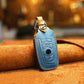 Blue leather key cover case with key ring and molded button icons