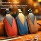Three leather key sleeves in red, blue, and brown with contrast edge stitching