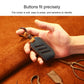 Blue round leather key cover held in hand, with key ring and stitched trim