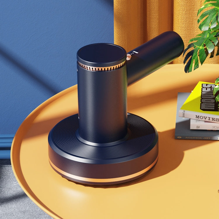 Blue handheld cordless vacuum on round charging base with angled nozzle canister