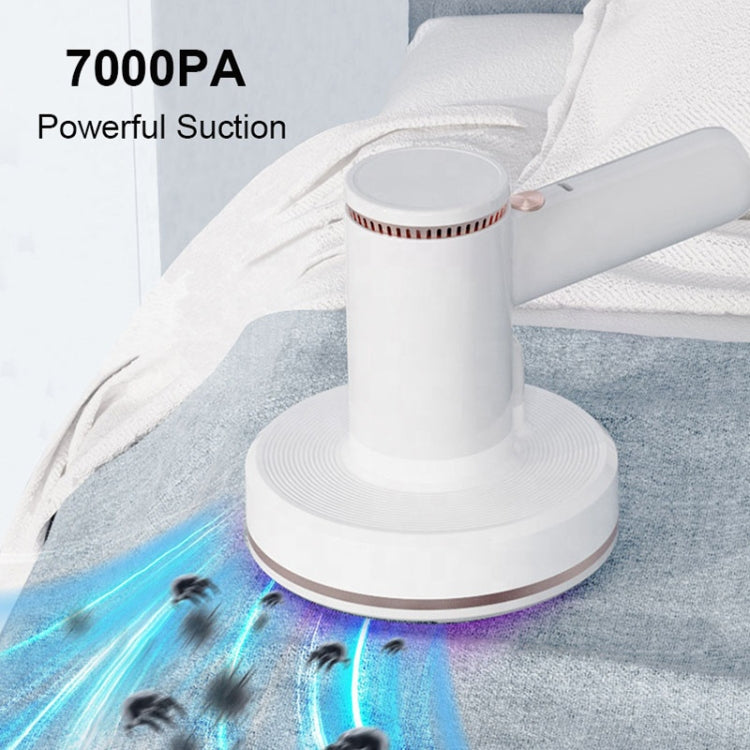 White handheld cordless vacuum sweeping fabric with visible suction effect