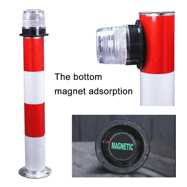 Red-and-white solar warning light post with black magnetic mounting base