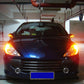 Car front with turn signal lights illuminated using LED bulbs