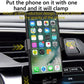 Black gravity-induction wireless charger clamp holding a smartphone