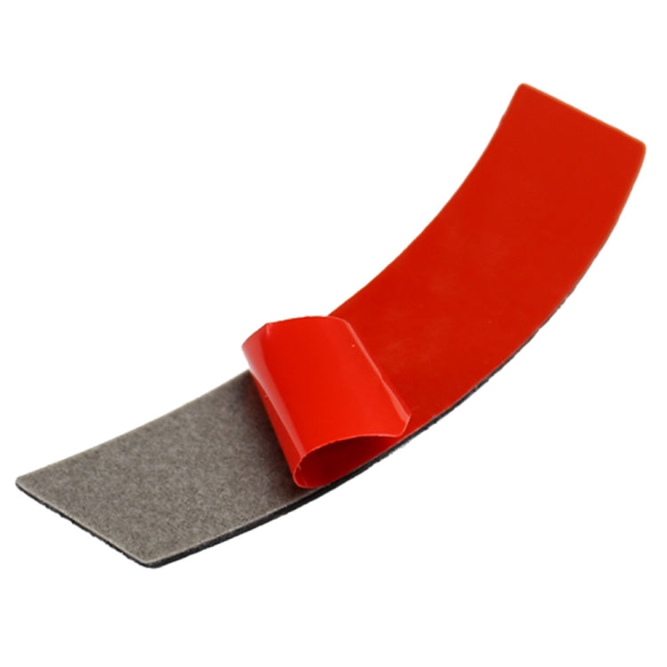 Red carbon fiber-style trim sticker with gray backing strip for installation