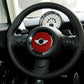 Installed red carbon fiber steering wheel center logo sticker with central emblem