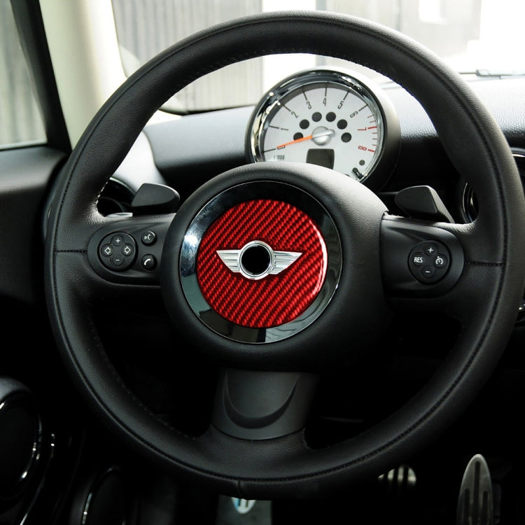 Installed red carbon fiber steering wheel center logo sticker with central emblem