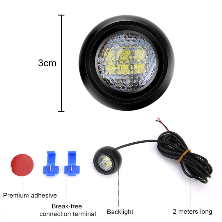 Black round LED reversing light with 2 m cable, mounting clips, and adhesive pads