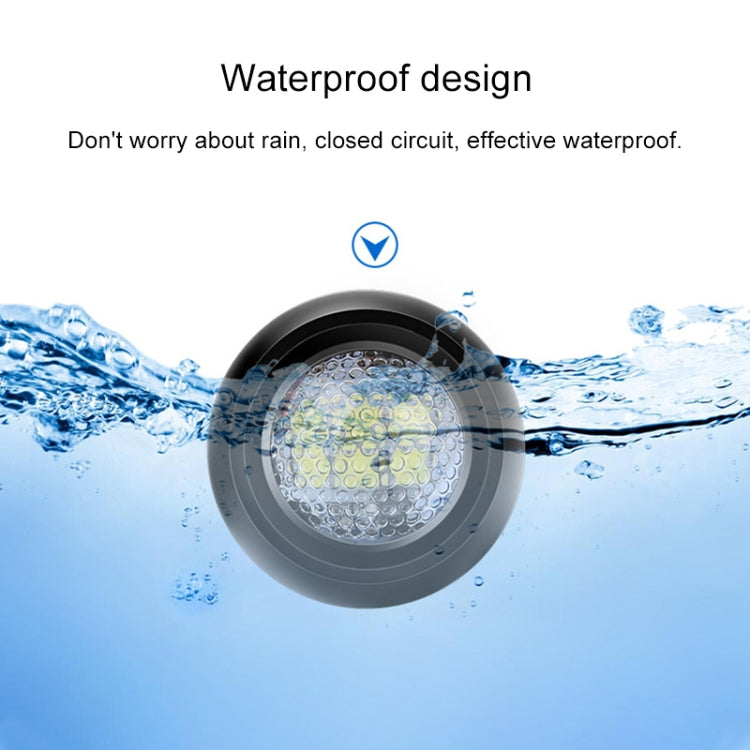 Black round LED reversing light with water droplets around the lens for protection