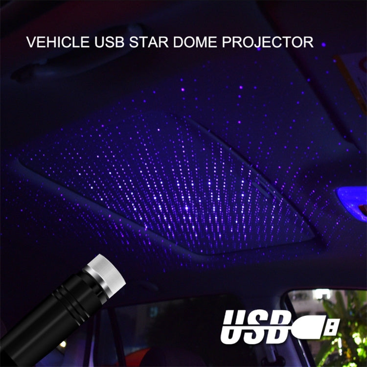 Purple-blue star dome projection from black USB car projector hose light