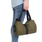 Army green canvas duffel-style tool bag with handles and zip pockets