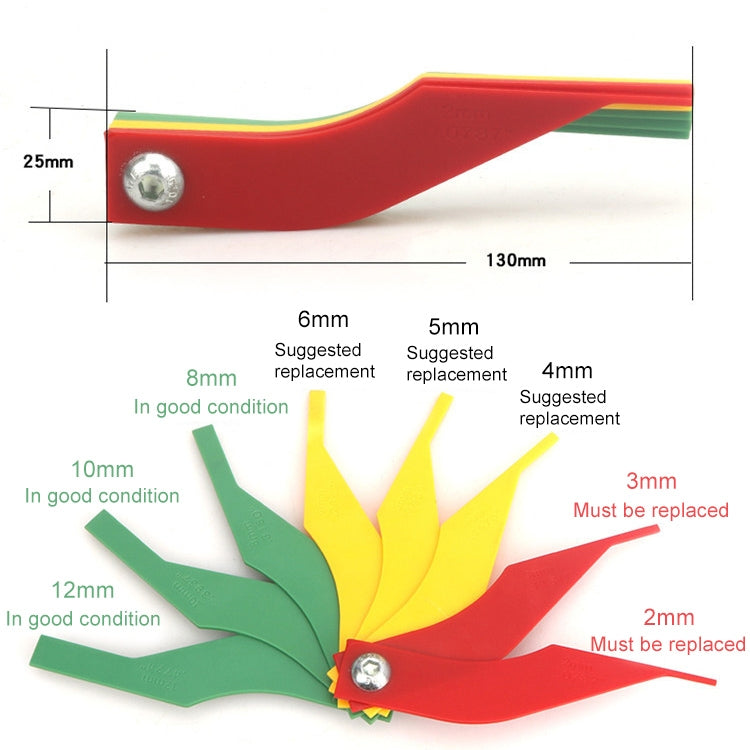 Brake pad thickness gauge with printed measurement scale markings and metal rivet