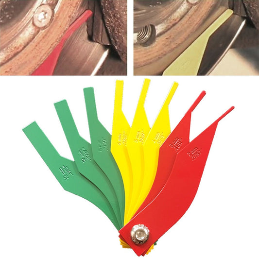 Multi-color brake pad thickness gauge with metal rivet and red scale edge