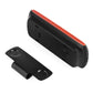 Black car speakerphone with orange trim and mounting clip, side view with control