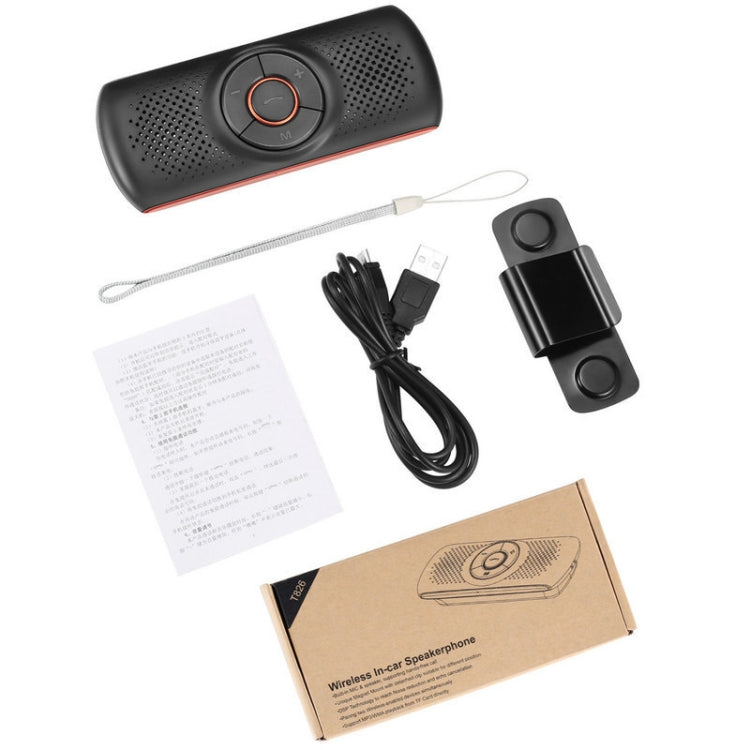 Black car speakerphone with orange trim plus USB cable, lanyard, and accessory pieces