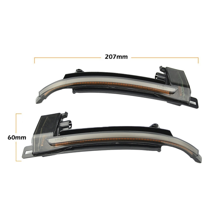 Pair of LED mirror turn signal light bars with smoked covers and mounting tabs, 207 mm.