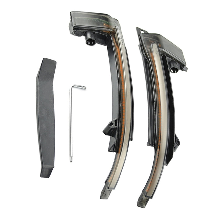 Two LED mirror turn signal lights with smoked lenses, plus a small mounting pin included.