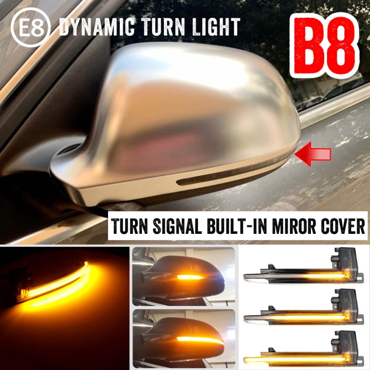 Side mirror turn signal cover with built-in amber dynamic LED light on a car.