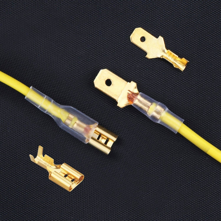 Gold and silver cable spade plug connectors with crimped wires and yellow insulation