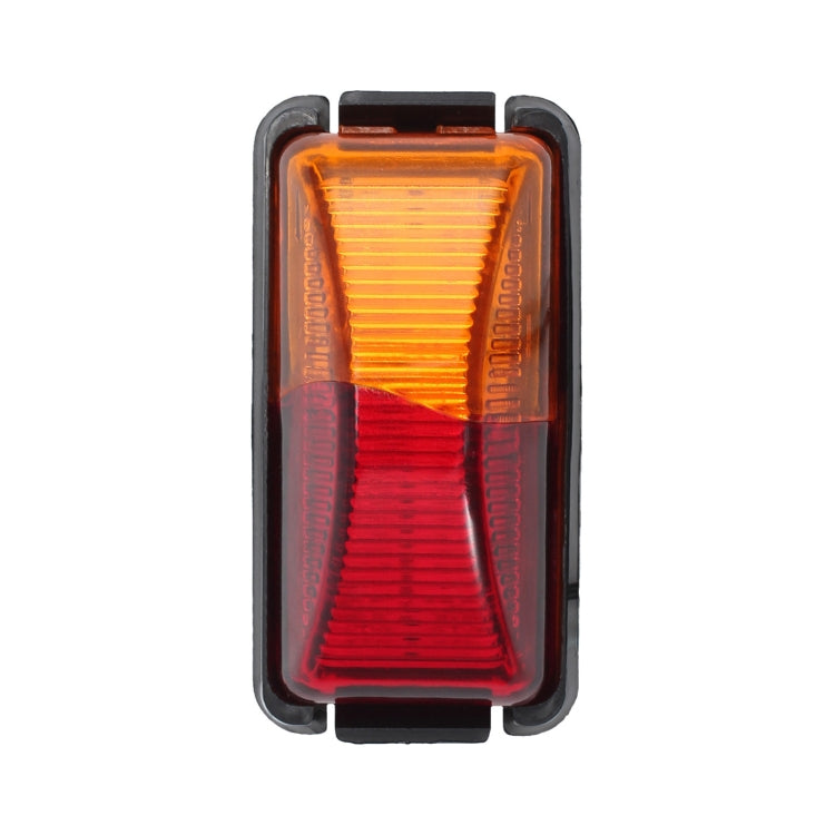 Truck side marker light with amber upper lens and red lower lens, black frame