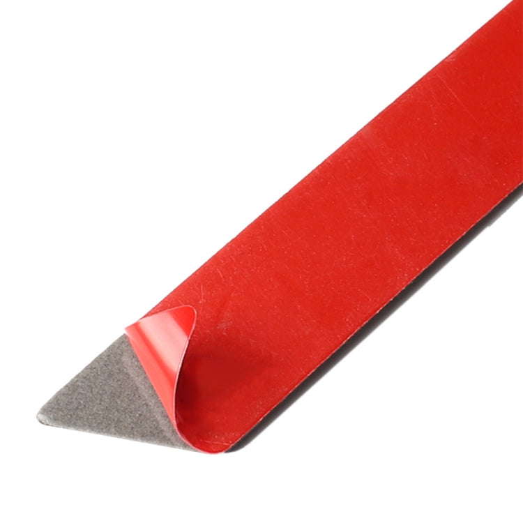 Red carbon-fiber style trim sticker with peel-off backing on one edge