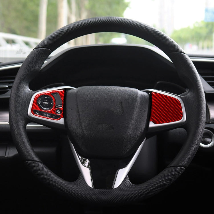 Steering wheel center with black hub and red carbon-fiber button trim accents