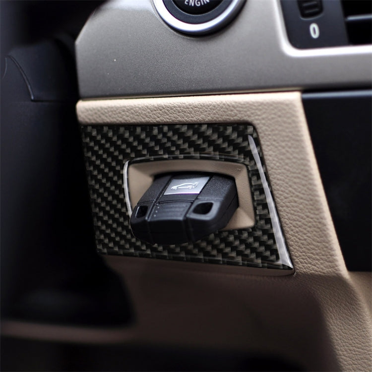 Carbon fiber ignition switch decorative sticker on dashboard trim with key cutout