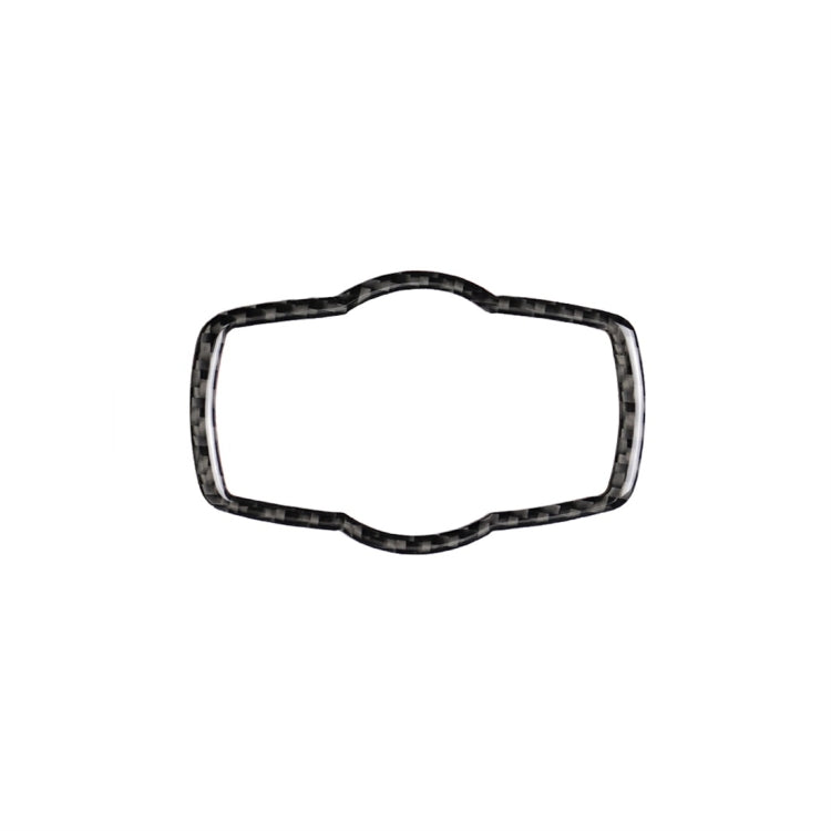 Carbon-fiber style headlight switch trim overlay with dark woven border outline