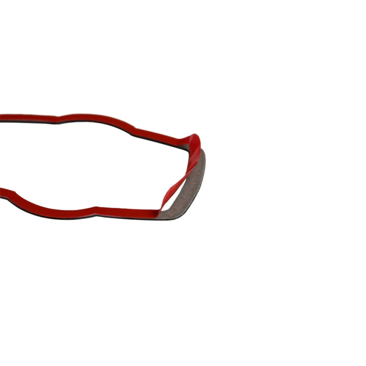 Carbon-fiber trim sticker with red backing layer and dark woven border