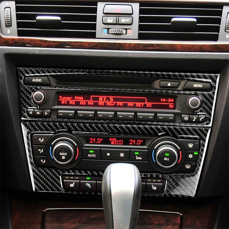 Carbon fiber CD panel trim sticker for BMW E90/E92 interior, installed on center console