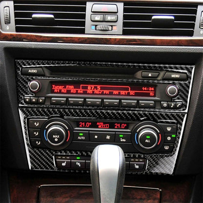 Carbon fiber CD panel trim sticker for BMW E90/E92 interior, installed on center console