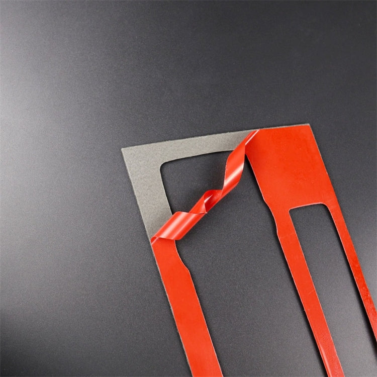 Carbon fiber trim sticker with red protective film on backing