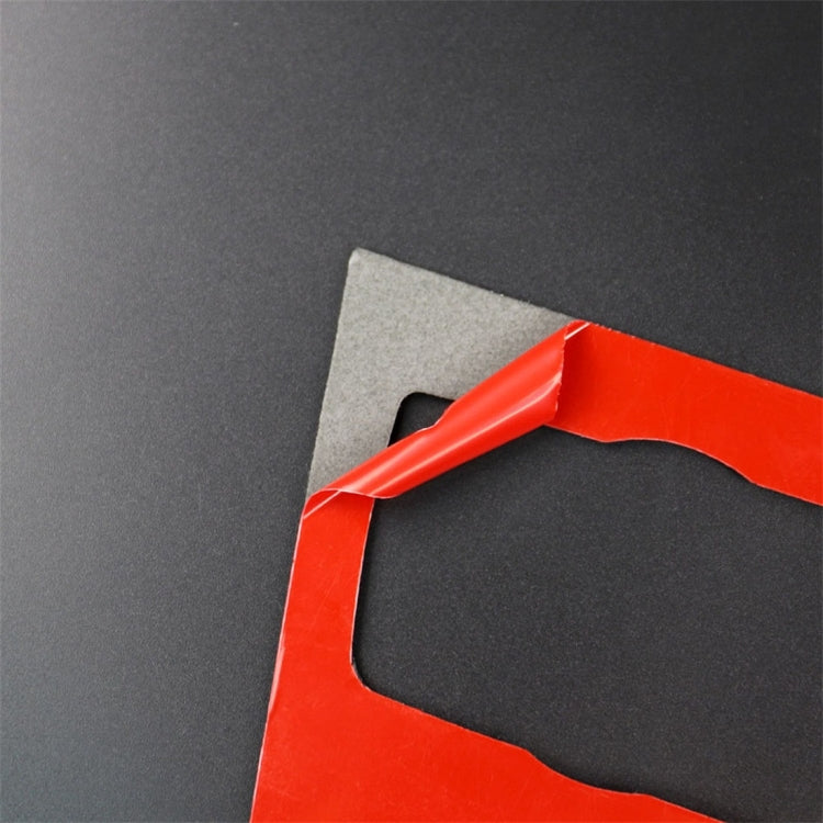 Carbon fiber style trim sticker with red installation tape on backing