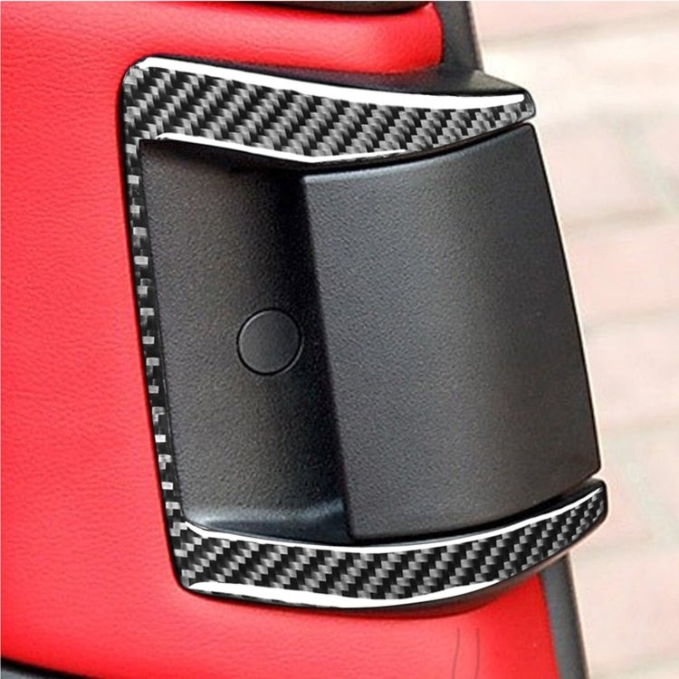 Rear door handle trim sticker with black carbon-fiber weave accents on dark handle