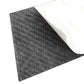 Curved black carbon fiber trim sticker with textured surface