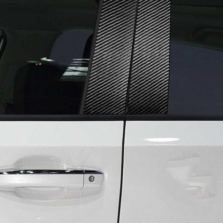 Installed carbon fiber B-pillar trim sticker on car door frame, black strips