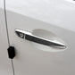 Carbon fiber outside door handle cover on a white car door, right side