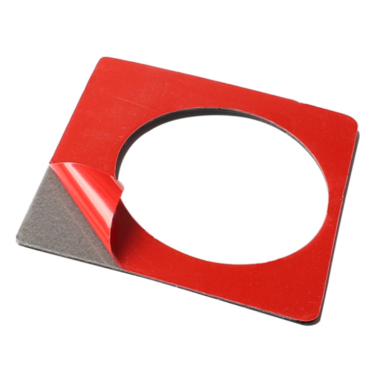 Carbon fiber knob bezel sticker with circular cutout on red backing