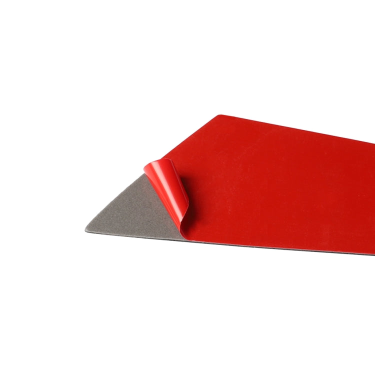 Carbon fiber side panel sticker with red protective backing and gray adhesive layer