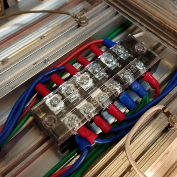 Installed 8-way dual-row power terminal with multicolor wires under screw terminals
