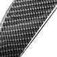 Close-up of carbon-fiber weave texture sheet in gray-black with glossy finish edge.