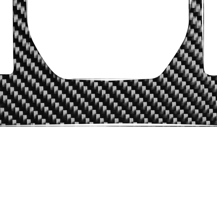 Carbon fiber gearshift panel trim with curved edge opening, black-gray weave texture