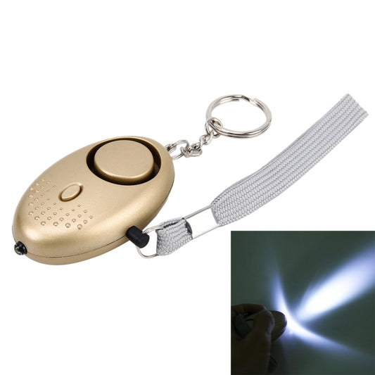 Gold personal alarm keychain with gray wrist strap and metal ring